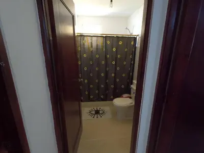 a bathroom with a shower with a toilet in it at Charming 2-Bedroom Apartment with Stunning Views in Santiago in Santiago de los Caballeros