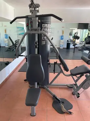 a gym with several exercise bikes in a room at Oceanfront apartment with views and pool in Los Corrales