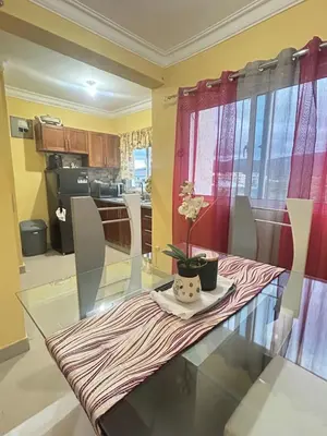 a glass table with a vase on it in a kitchen at Garden view paradise in Concepción de La Vega