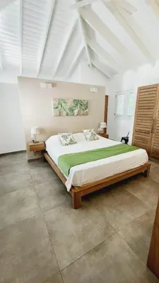 a bedroom with a large bed in a room at Villa Exceptional location - Las Ballenas in Las Terrenas