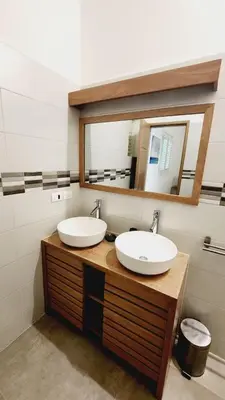 a bathroom with two sinks and a mirror at Villa Exceptional location - Las Ballenas in Las Terrenas