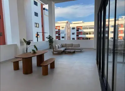 a living room with a couch and a table at Relaxing & New Retreat 3 bedroom riviera Verde in Santo Domingo