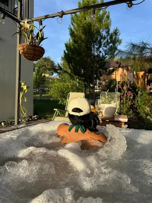 a woman in a jacuzzi in a bath tub at La Gloria in San José de Ocoa