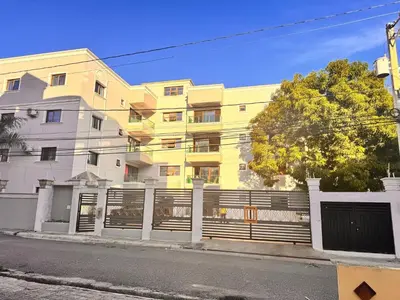a yellow building with a fence in front of it at Enjoy Huge 4 bedrooms, and 3 bathrooms, 8 new apartments in Santiago de los Caballeros