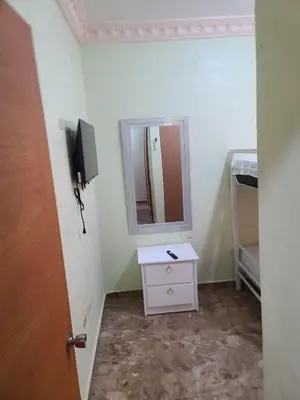 a bathroom with a white dresser and a mirror at Apartahotel Henry Winche in Sabana Grande de Boyá
