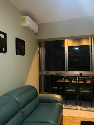 a living room with a couch and a dining table at MarMary Ocean view by Marina in Boca Chica