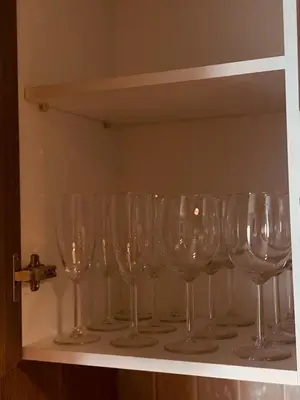 a row of wine glasses sitting on a shelf at MarMary Ocean view by Marina in Boca Chica