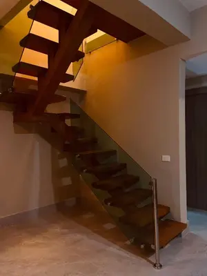 a wooden staircase in a room with a ceiling at MarMary Ocean view by Marina in Boca Chica