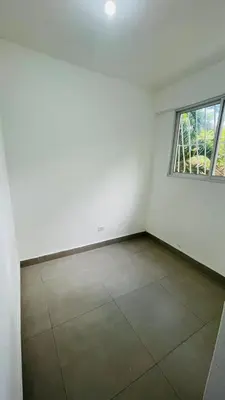 an empty room with a window and a tiled floor at beach apartment cafe del sol in La Puntica de Juan Dolio