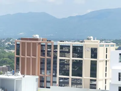 a view of a building with mountains in the background at Soha Suites II Deluxe in Colorado