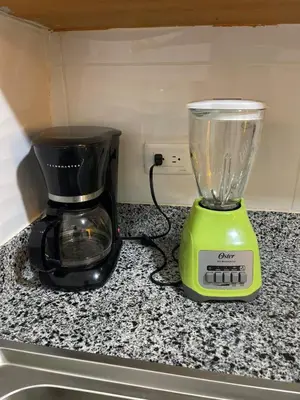 a blender sitting on a counter next to a sink at Beautifull and Luxe Apartment 10 mn to the Int Airport in Los Paredones