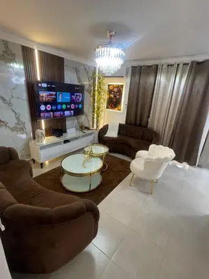a living room with a couch and a tv at Beautifull and Luxe Apartment 10 mn to the Int Airport in Los Paredones