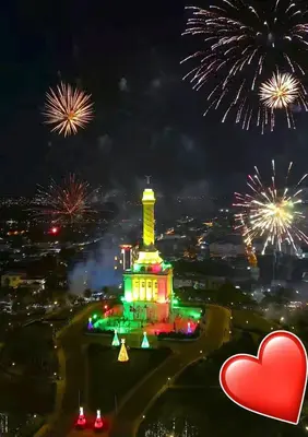 a view of a lit up lighthouse with fireworks at Hermoso Alojamiento con Terraza y Jacuzzi en Santiago in Santiago de los Caballeros