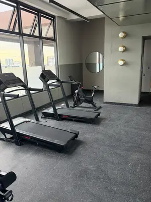 a gym with several exercise bikes in a room at Downtown, Cozy and Modern! in Santo Domingo