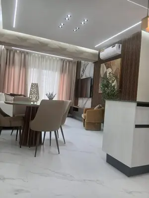 a living room with a dining table and chairs at Downtown, Cozy and Modern! in Santo Domingo