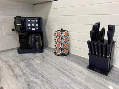 a kitchen with a bunch of knives and a knife block at Blue Oasis Luxury in Sosúa