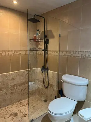 a bathroom with a toilet and a shower at Cozy 3 Bedroom Apartment with Pool & Private Beach in Bávaro Punta Cana in Punta Cana