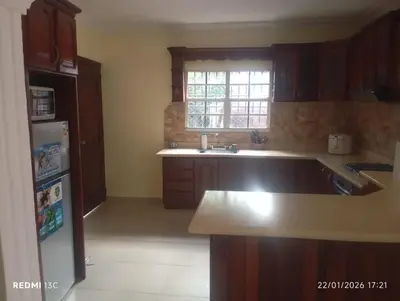 a kitchen with a sink and a refrigerator at Casa vacanza, Mendosa in Bayaguana