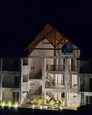 an apartment building at night with its lights on at Mila Apartment in Bayahibe