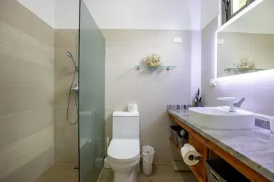 a bathroom with a sink and a toilet and a shower at Pro Cab Apartment - Washer - BBQ in Cabarete