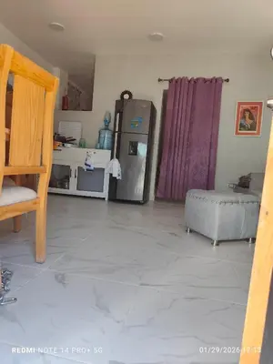 a kitchen with a stainless steel refrigerator in a room at housing Freddy in Santo Domingo