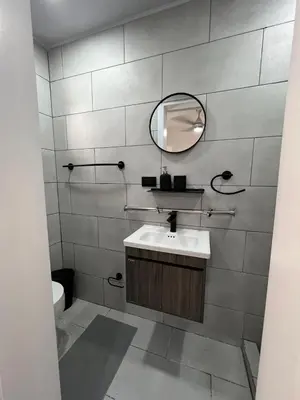 a bathroom with a sink and a mirror at Bijoc 01 Apartment in San Felipe de Puerto Plata