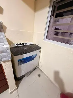 a stove sitting in a corner of a kitchen at Super Apartment 10 mn to the Int Airport
