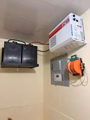 a box is hanging on a wall next to a fire hydrant at Super Apartment 10 mn to the Int Airport