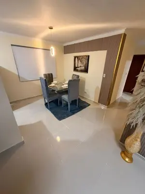 a dining room with a table and chairs at Super Apartment 10 mn to the Int Airport