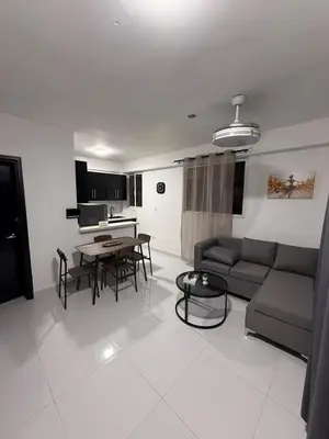 a living room with a couch and a table at Moon Apartamentos C4 in San Cristóbal