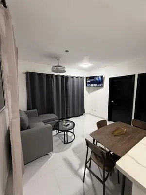 a living room with a couch and a table at Moon Apartamentos C4 in San Cristóbal