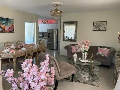 a kitchen and living room with a table and chairs at My Little House in Constanza