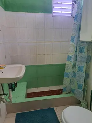 a bathroom with a sink and a toilet and a shower at Fresh