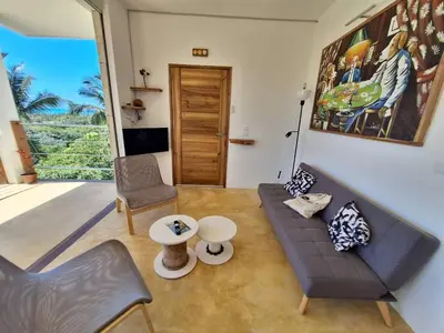 a living room with a couch and a table at Apartment Mariquita in Las Terrenas