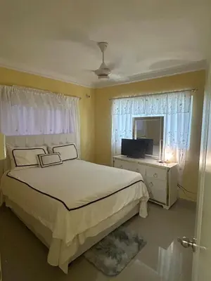 a bedroom with a bed and a television in it at Garden view paradise La Vega in Concepción de La Vega