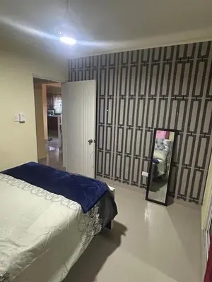 a bedroom with a bed and a mirror at Garden view paradise La Vega in Concepción de La Vega