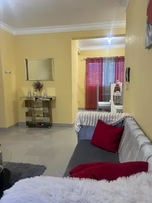 a living room with a couch and a table at Garden view paradise La Vega in Concepción de La Vega
