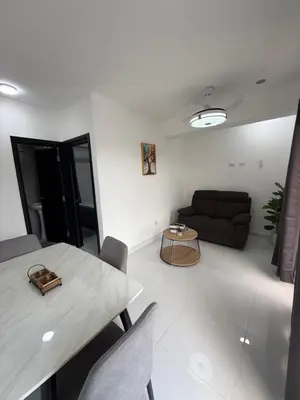 a living room with a table and a couch at Moon Apartamentos D2 in San Cristóbal
