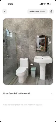 a bathroom with a toilet and a sink and a shower at Lissette altagracia in Concepción de La Vega