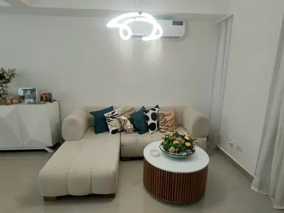 a living room with a couch and a table at Pure relax in Bavaro La Casita de Giò in Punta Cana