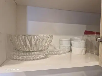 a shelf with a bowl and other dishes on it at Pure relax in Bavaro La Casita de Giò in Punta Cana
