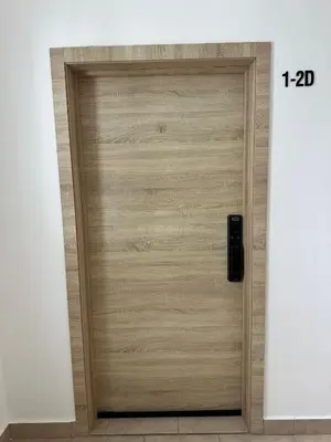 a wooden door in a room with the number at Luz y paz