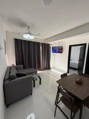 a living room with a couch and a table at Moon Apartamentos D3 in San Cristóbal