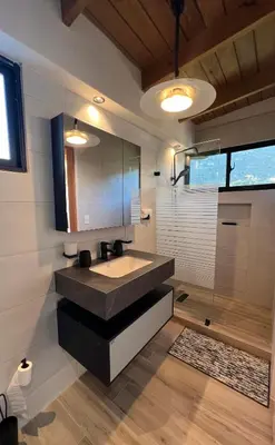 a bathroom with a sink and a mirror at Azotea Quinta Galarza