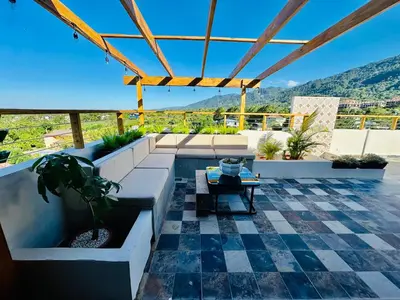 a patio with a table and a view of a mountain at Azotea Quinta Galarza