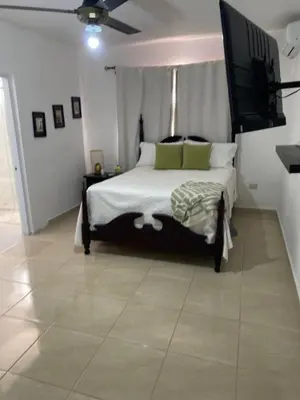 a bedroom with a bed and a flat screen tv at Casa campo Ana Victoria