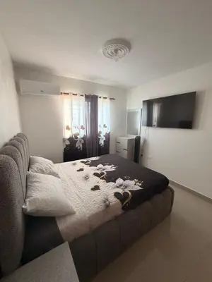 a bedroom with a bed with rocks on it at Santo domingo Avenida España