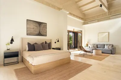 a white bedroom with a bed and a couch at Luxury 3BR Penthouse in Casa de Campo, Gated Resort Living & Golf View in La Romana