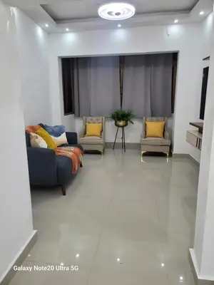 a living room with a couch and two chairs at Colonial suites in Santo Domingo