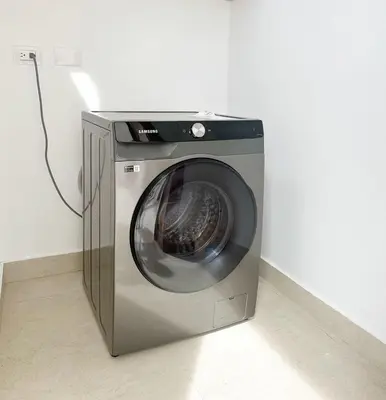 a washing machine sitting in a corner of a room at Sunset Calm Penthouse in Cabarete